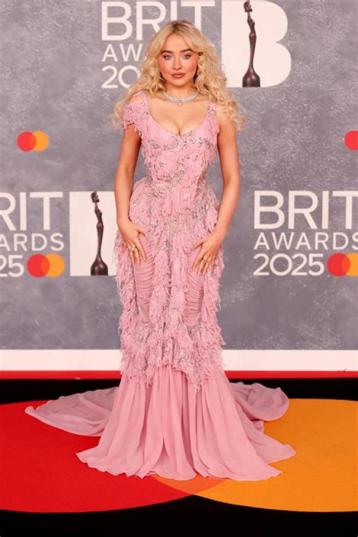 Pixie Lott Suffers Wardrobe Malfunction At BRITS As High Slit Dress Flies Open