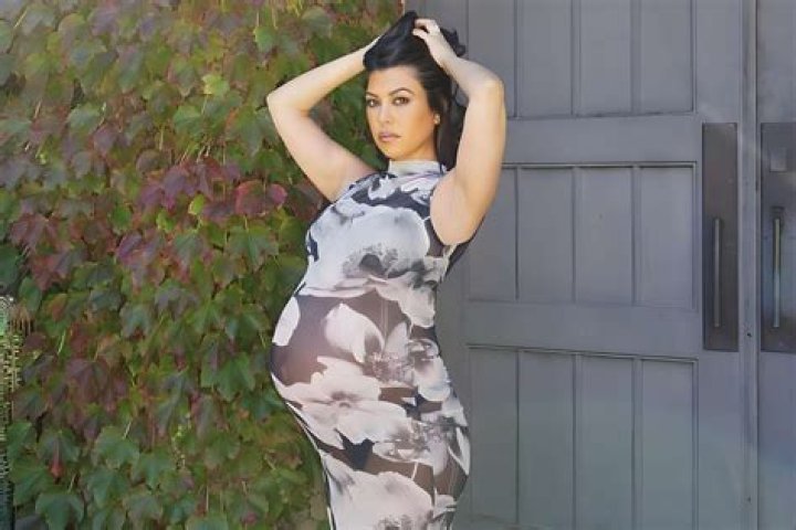 Pregnant Kourtney Kardashian Shows Off Her Growing Bump In Strapless Mini Dress In New Photos