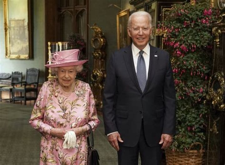 Queen Elizabeth Is Regal In Pink Dress As She Hosts Joe & Jill Biden For Tea At Windsor Castle — Pics