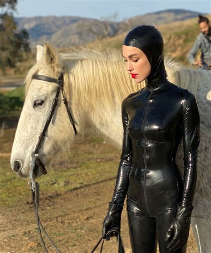 Rainsford Fulfills Her Weird ‘Prophecy’ By Riding A Horse While In Full Latex For ‘2 Cents’ Video
