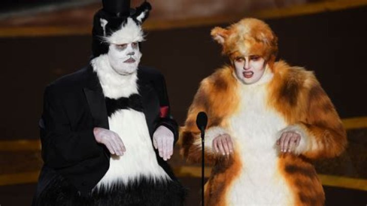 Rebel Wilson & James Corden Dress As Their ‘Cats’ Characters & Take Shots At The Flop Film At The Oscars
