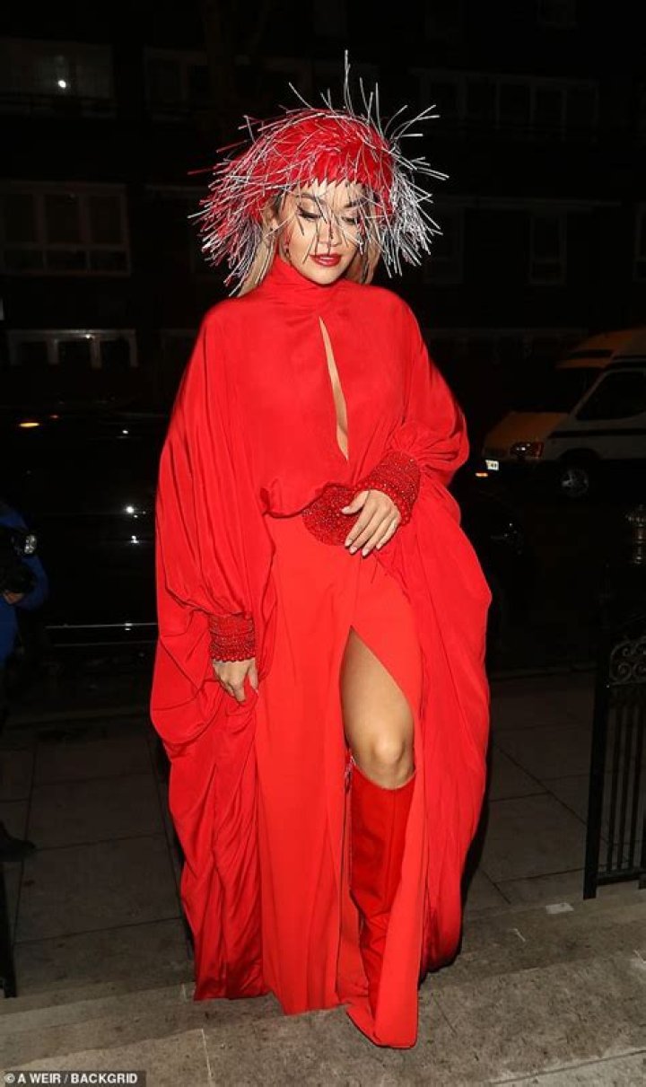 Rita Ora Suffers Wardrobe Malfunction & Reveals Spanx Under Bright Red Dress In London — Pics
