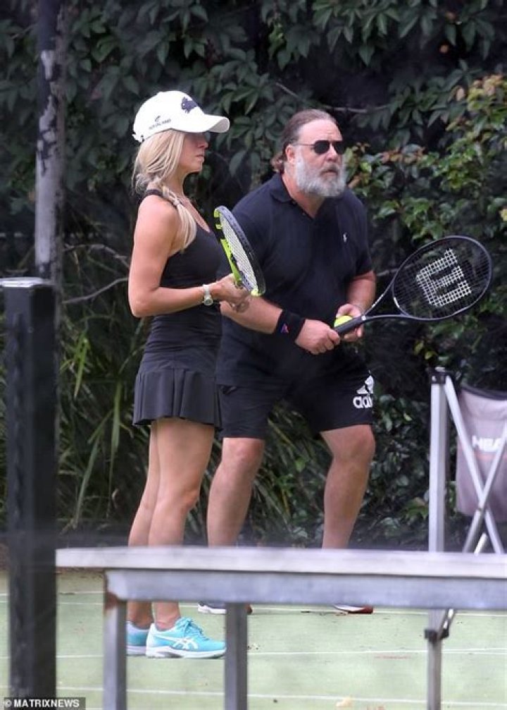 Russell Crowe, 56, Passionately Kisses Rumored Girlfriend Britney Theriot, 30, During Tennis Match