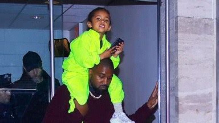 Saint West, 4, Rocks Bright Neon Green Outfit While Riding On Dad Kanye’s Shoulders — Cute Pics