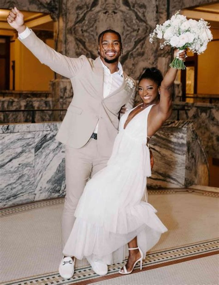 Simone Biles Cuddles Fiancé Jonathan Owens While Wearing $500 Burberry Swimsuit