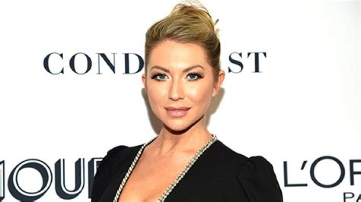 Stassi Schroeder’s Bare Baby Bump Pops Out Of Her PJs As She Chows Down On Food — Pic