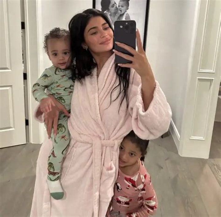 Stormi Webster Rocks Adorable Curls & A White Dressing Gown On Luxury Vacay With Mom Kylie – Pics