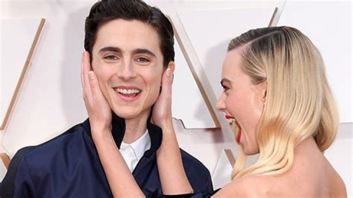 Timothee Chalamet Photobombs Margot Robbie On Oscars Red Carpet – Hollywood Life