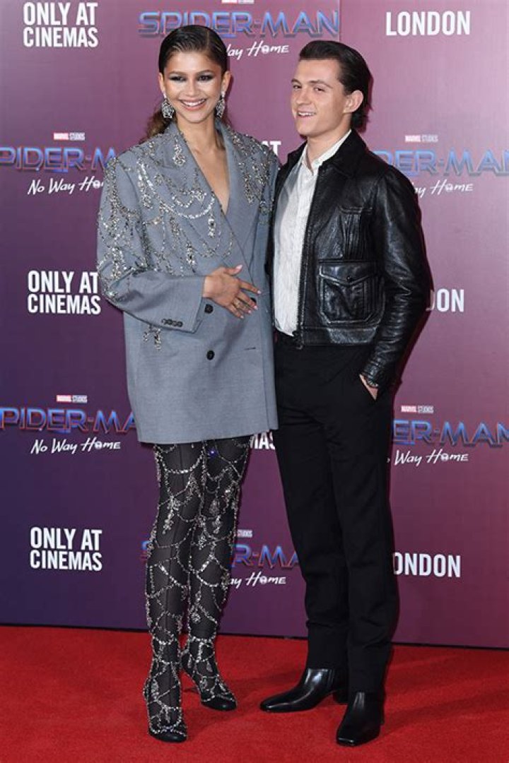 Tom Holland Sweetly Kisses Zendaya on London Stroll in Rare PDA Photos