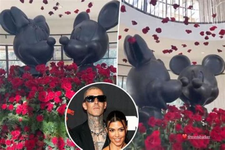 Travis Barker Gifts Kourtney Kardashian Giant Disney Statues & Roses For Valentine’s Day