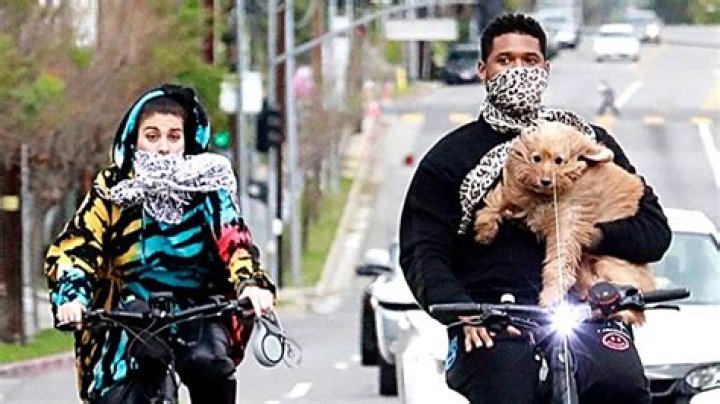 Usher Cradles His Dog In His Arms On Bike Ride With His GF — See Pics