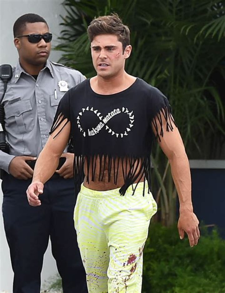 Zac Efron Shows Off Ripped Arms & Toned Abs In Fringe Crop Top — Pic